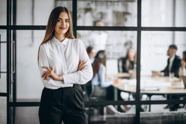 woman business owner standing proudly