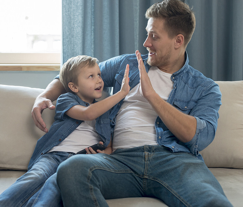 Man high-fiving son