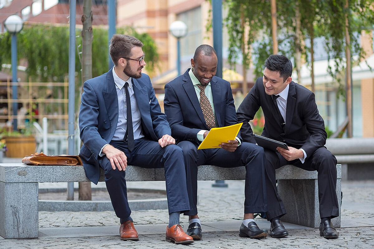 3 executives talking