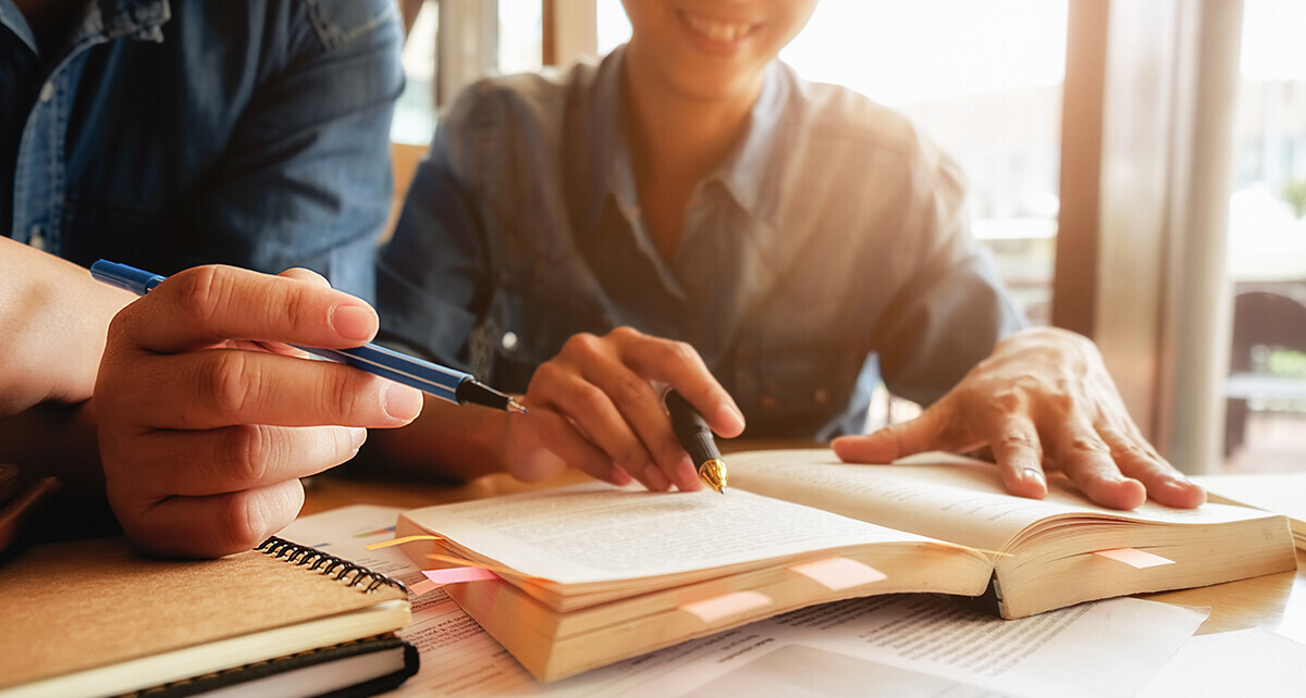 Students studying a text book