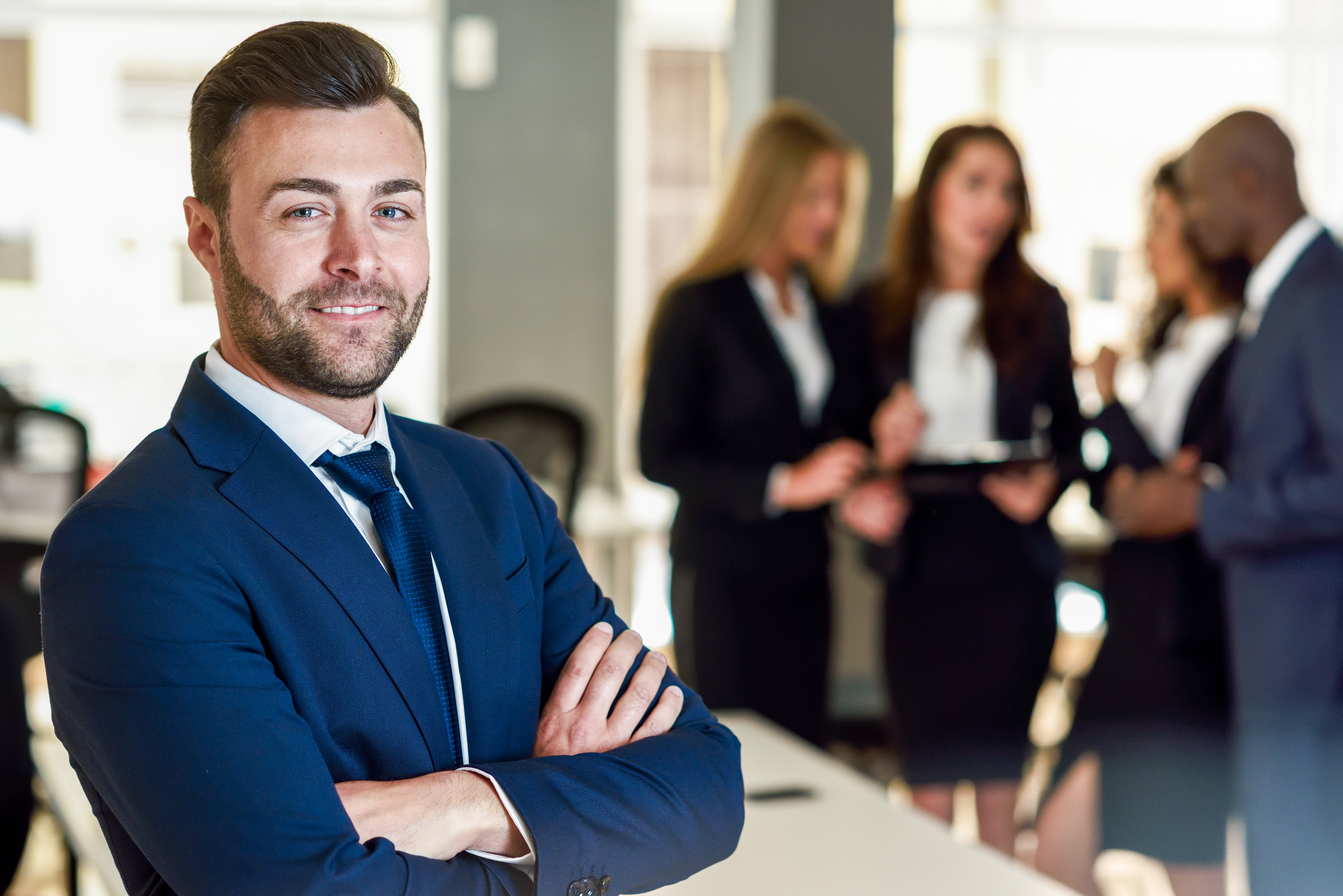 businessman standing with coworkers