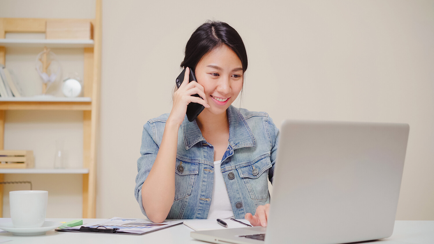 Woman working on laptop at home