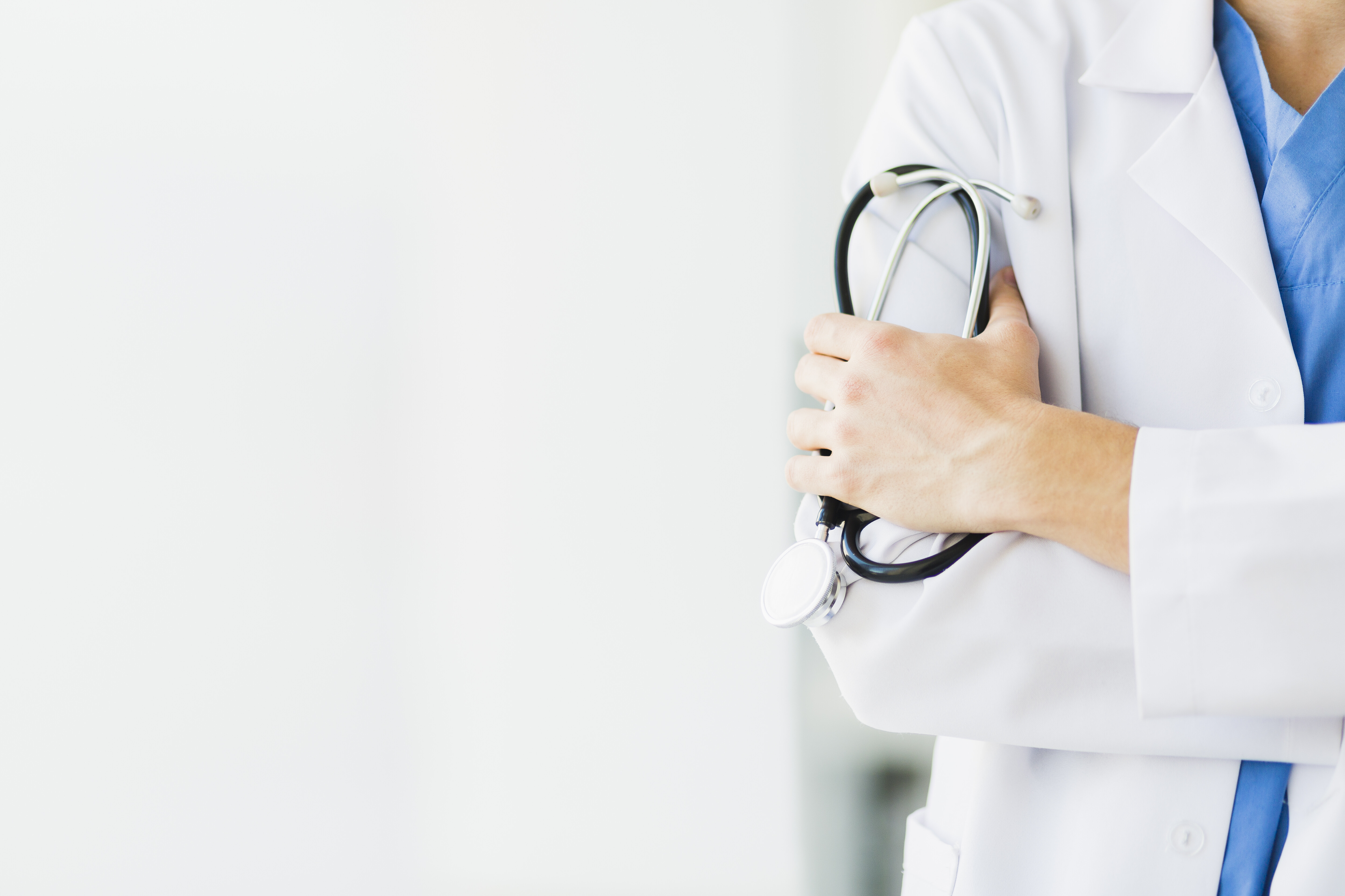 medical doctor standing with arms crossed