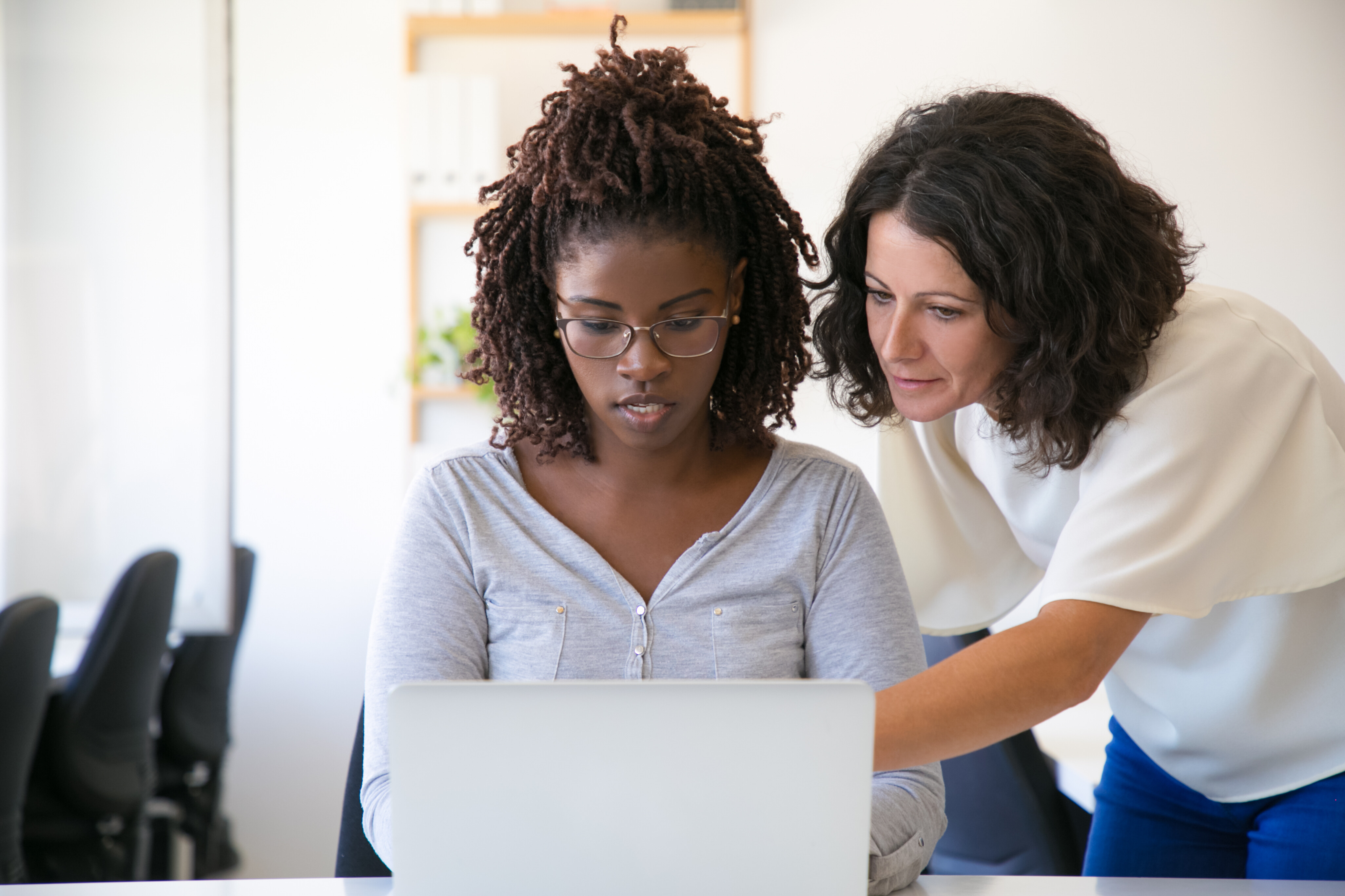 Two professional businesswomen talking