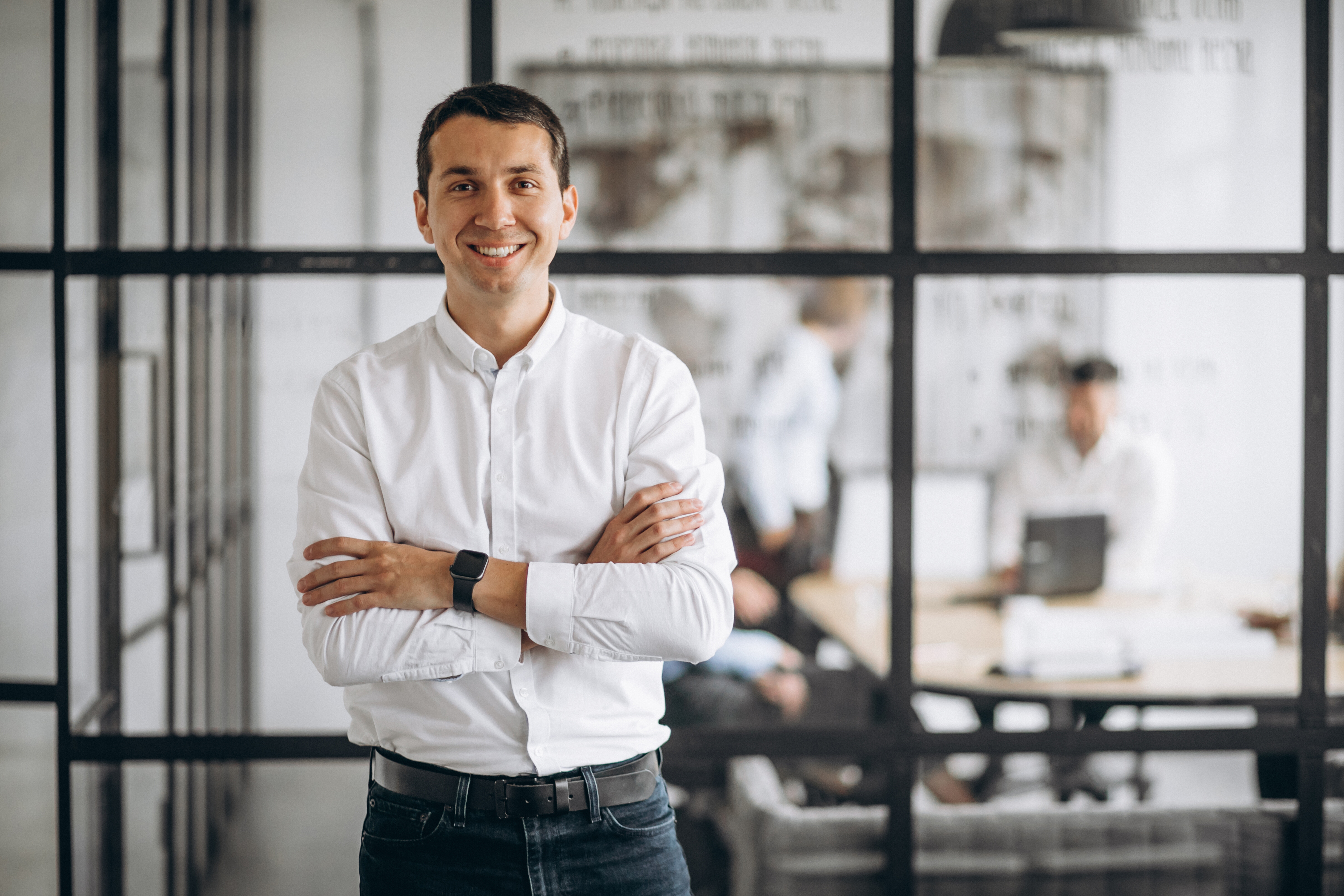 Businessman standing with his arms crossed