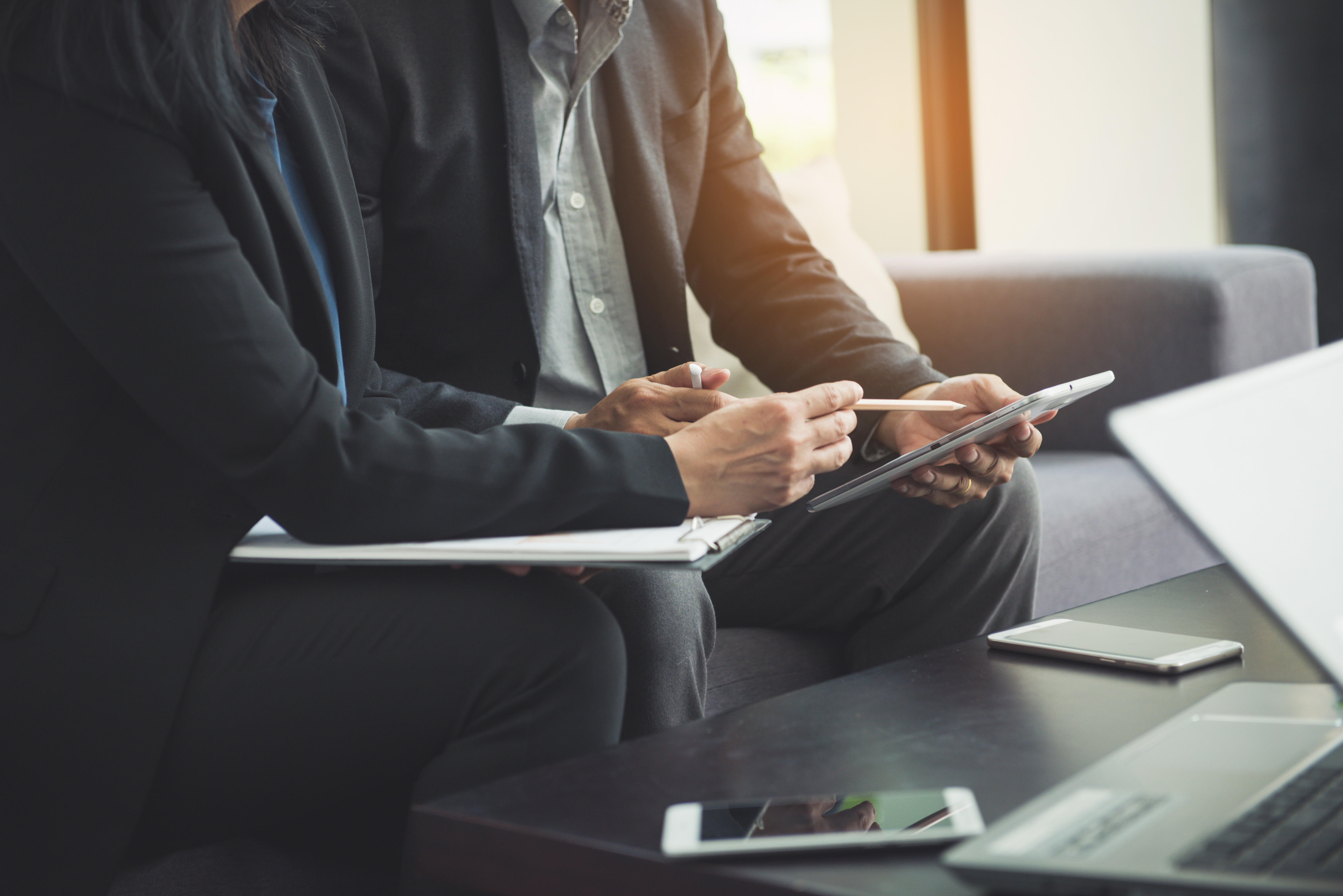 Two business professionals reviewing a document