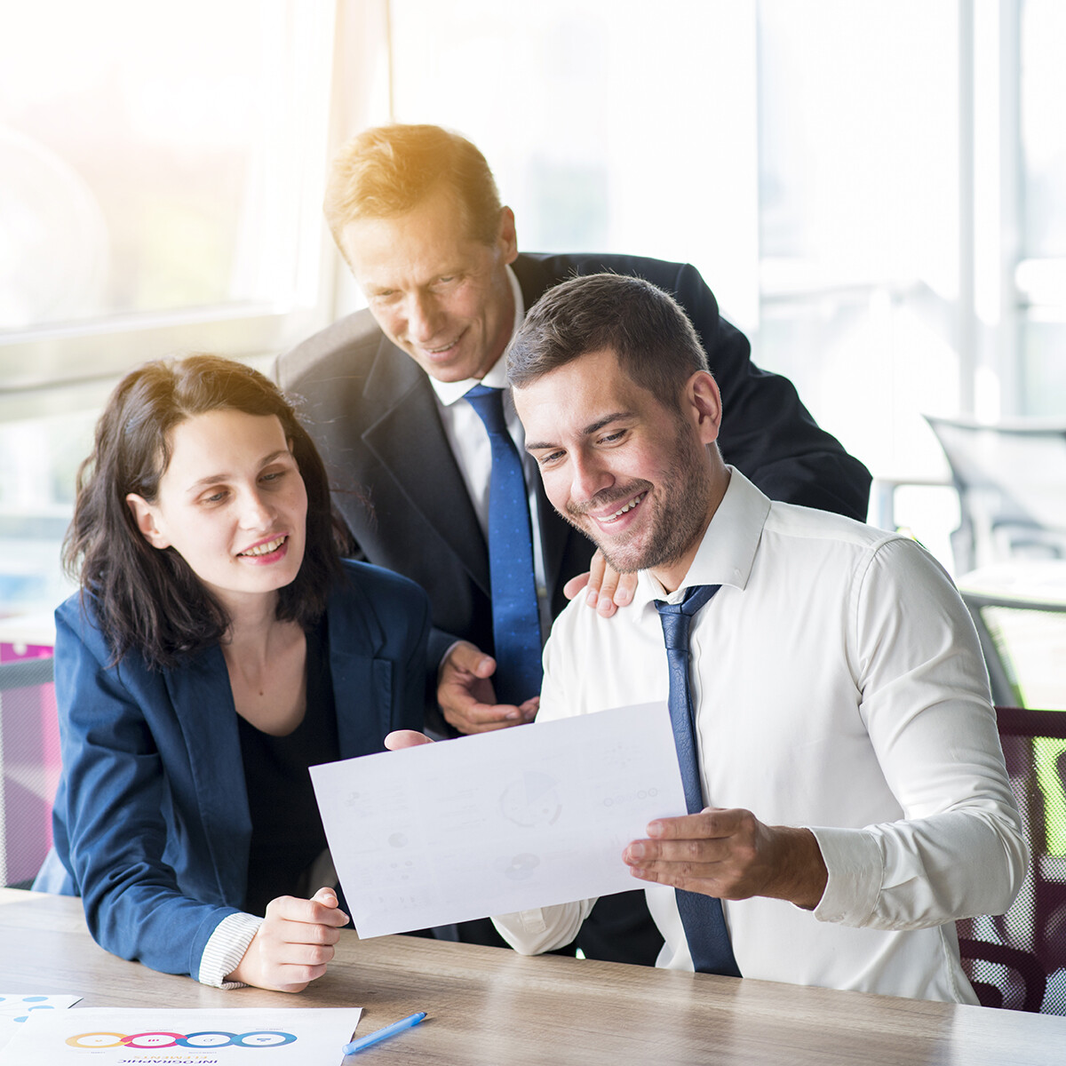 Coworkers discussing a document