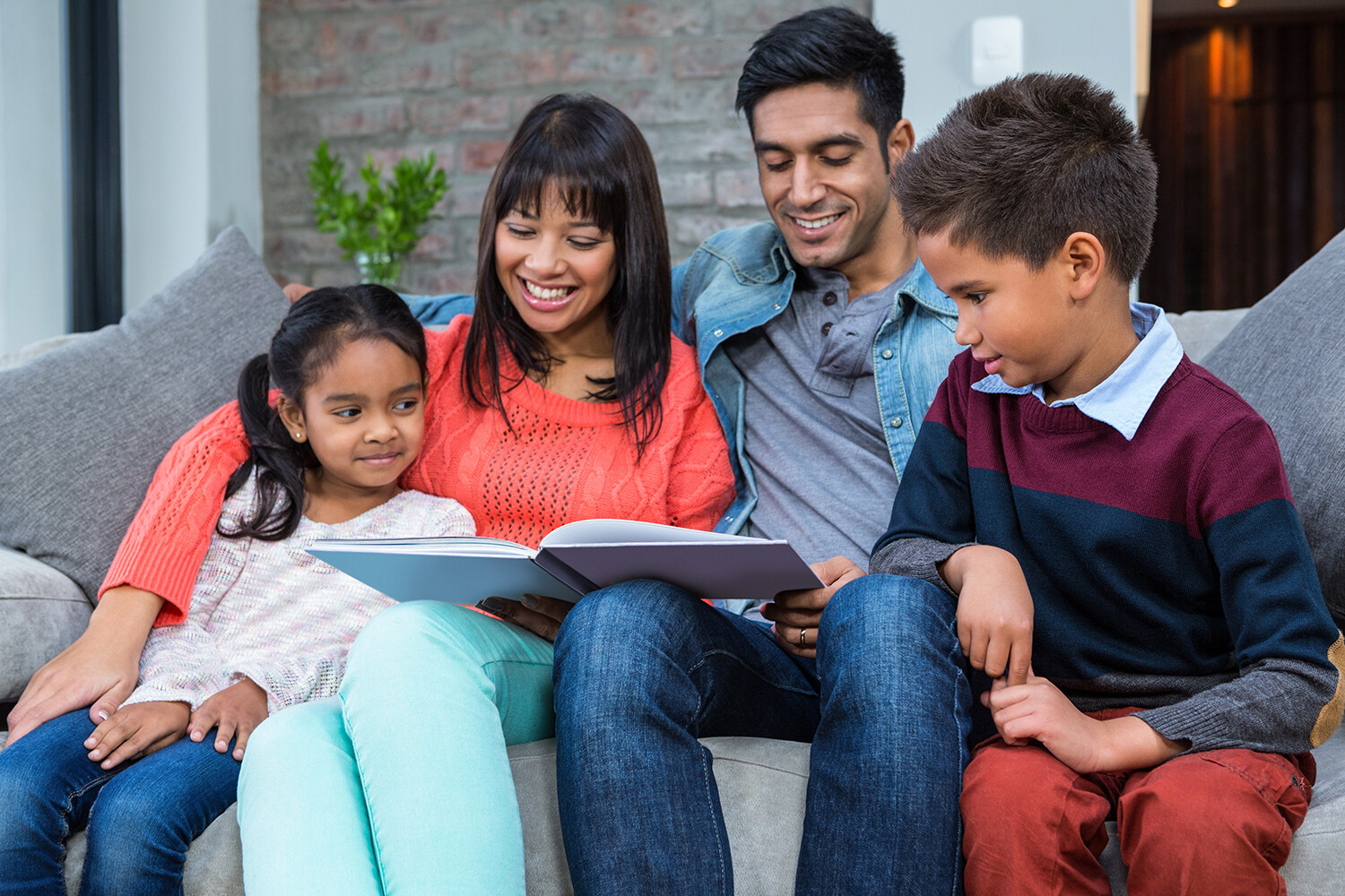 Family reading a book together